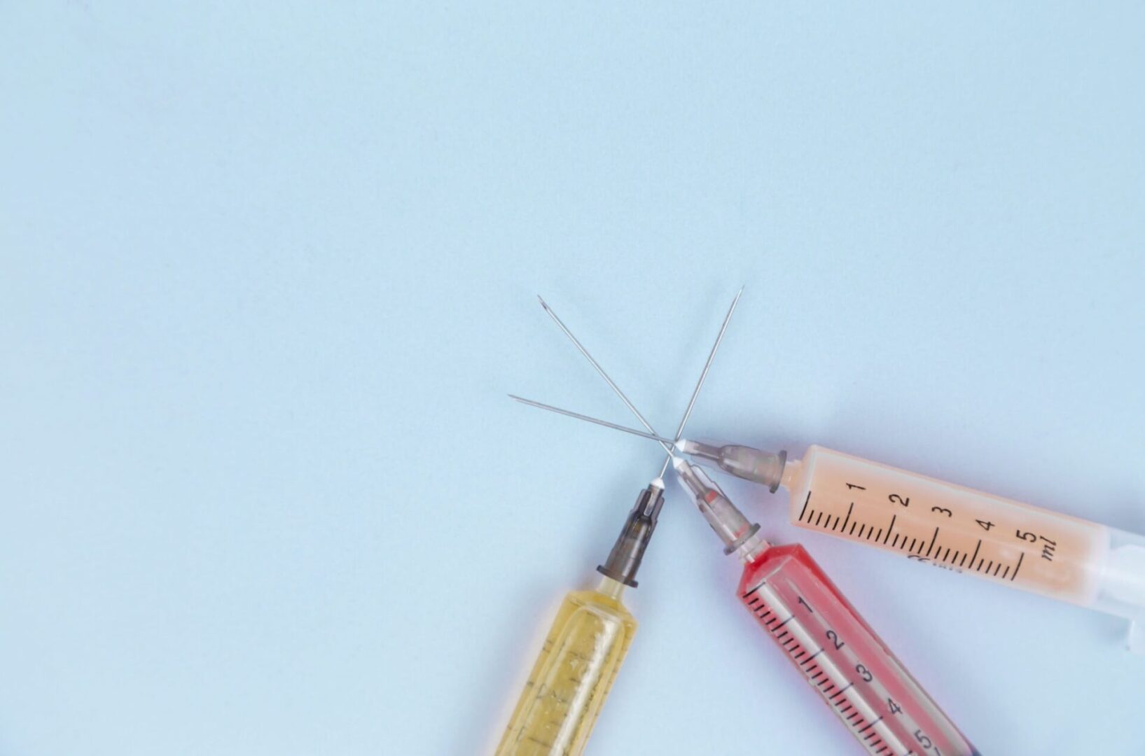 A pair of scissors and a ruler on top of a table.